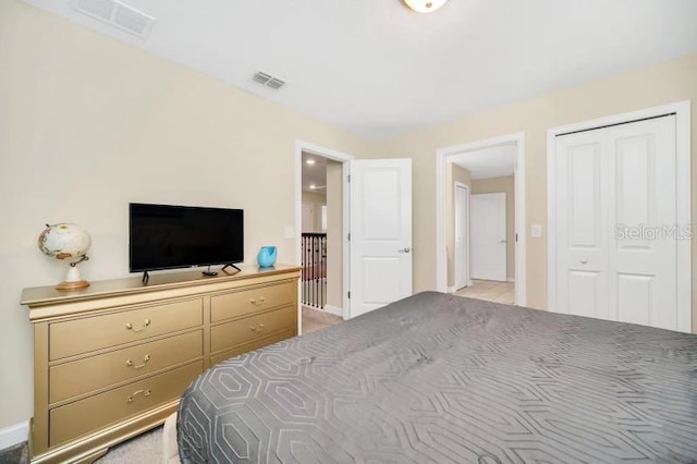 carpeted bedroom with a closet