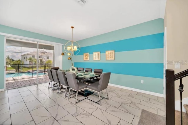 tiled dining area with a chandelier