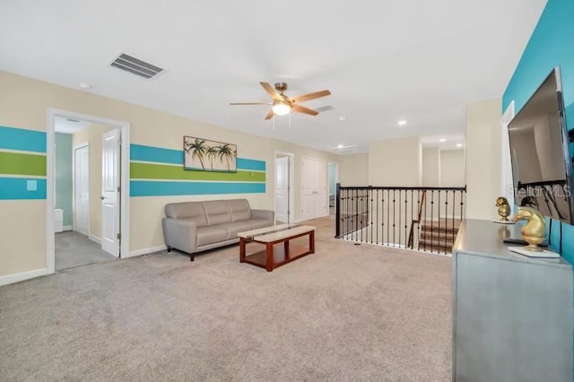 living room with light colored carpet and ceiling fan