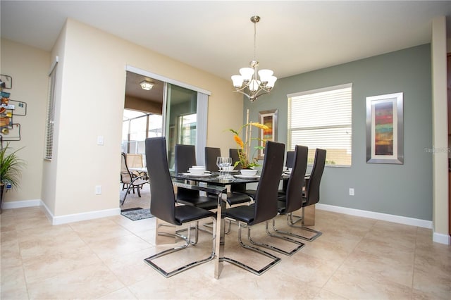 tiled dining space with a notable chandelier and plenty of natural light