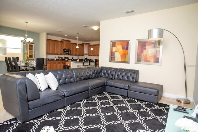 living room featuring a chandelier