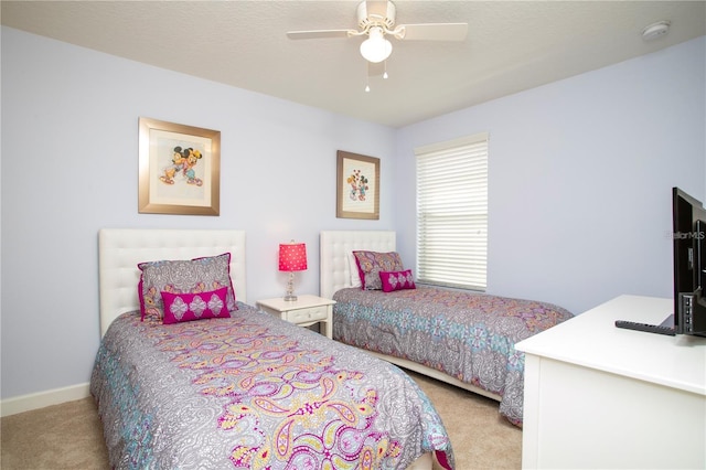 bedroom featuring ceiling fan and carpet flooring