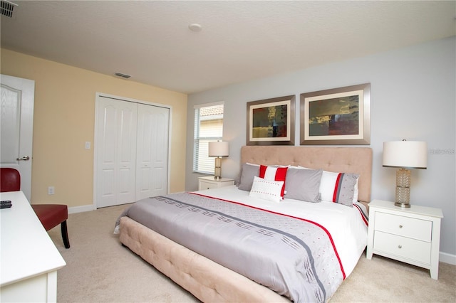 carpeted bedroom featuring a closet