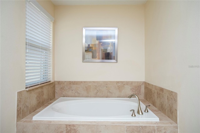 bathroom featuring tiled bath