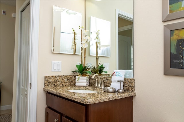 bathroom with vanity with extensive cabinet space