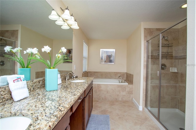 bathroom featuring tile floors, vanity with extensive cabinet space, shower with separate bathtub, and dual sinks