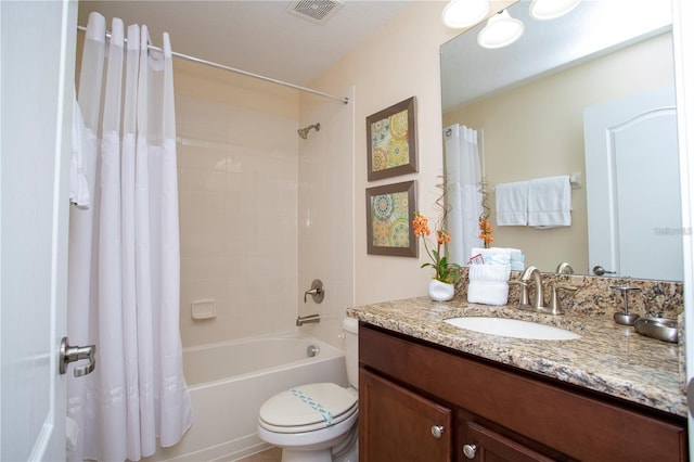 full bathroom with toilet, shower / tub combo with curtain, and large vanity