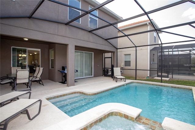 view of pool featuring a patio and glass enclosure