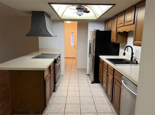 kitchen featuring appliances with stainless steel finishes, sink, light tile flooring, ceiling fan, and custom exhaust hood