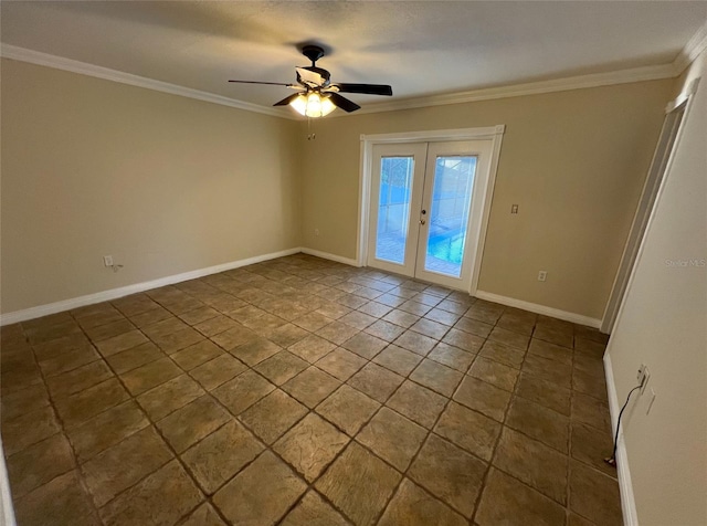 spare room featuring tile flooring, ornamental molding, ceiling fan, and french doors