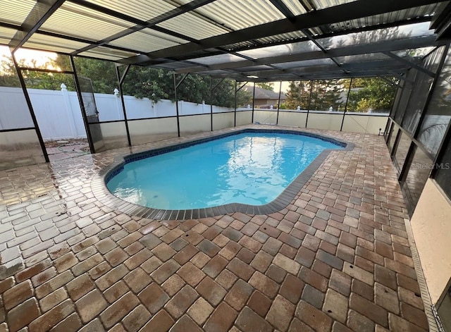 view of pool featuring a lanai and a patio area