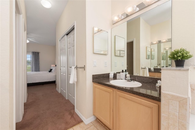 bathroom featuring tile flooring, oversized vanity, and ceiling fan