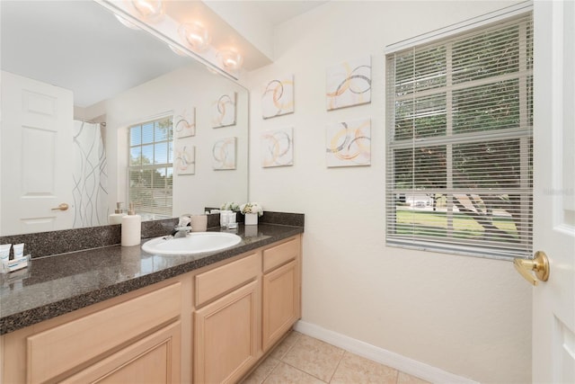 bathroom with tile floors and vanity