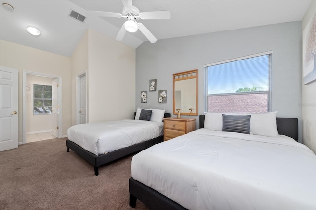 bedroom with carpet flooring, ceiling fan, and vaulted ceiling