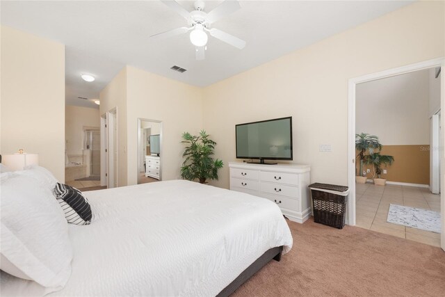 carpeted bedroom with ceiling fan and connected bathroom