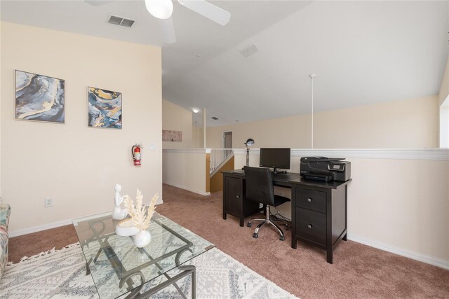 home office with light colored carpet, ceiling fan, and lofted ceiling