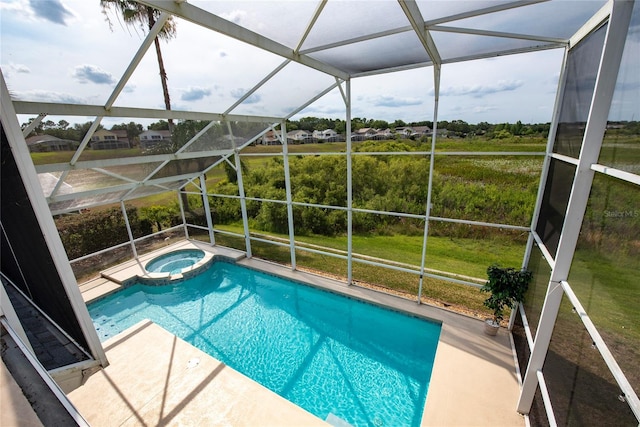 view of swimming pool with a yard, a lanai, an in ground hot tub, and a patio