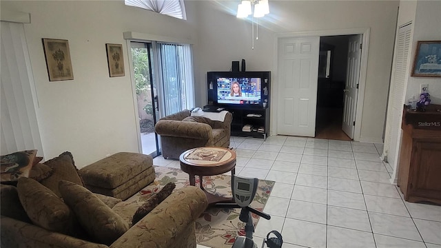 living room featuring ceiling fan and light tile patterned floors