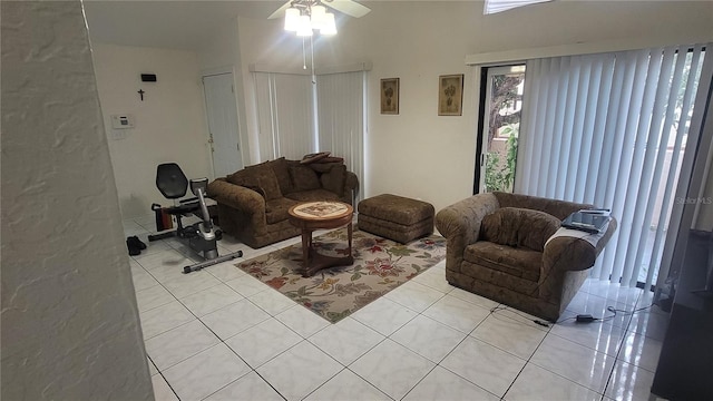 tiled living room with ceiling fan