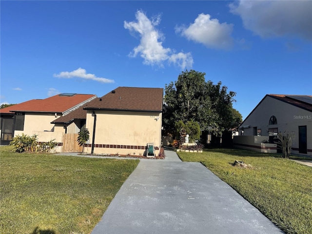 view of property exterior with a yard