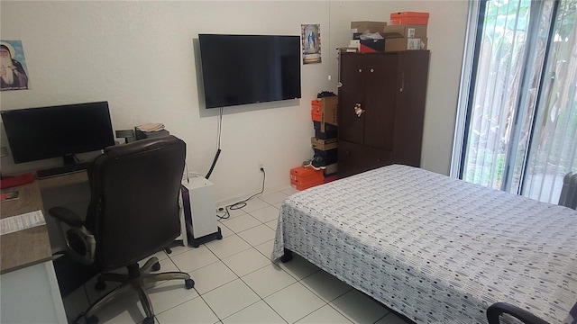 bedroom with light tile patterned flooring