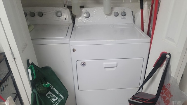 washroom with washer and dryer