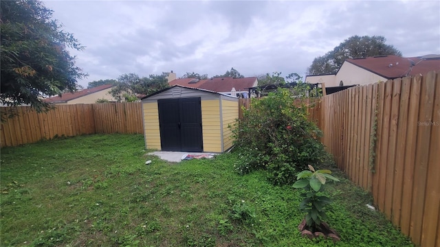 view of outbuilding featuring a lawn