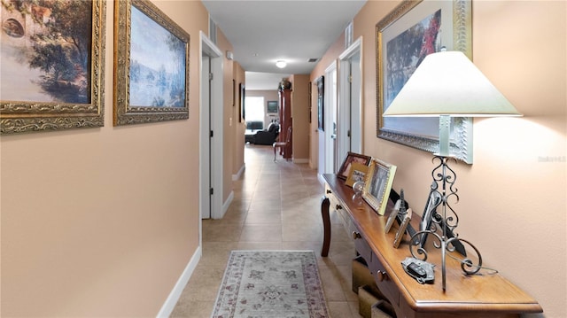 hallway featuring light tile patterned floors