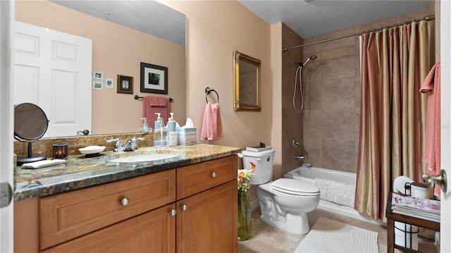 full bathroom featuring toilet, vanity, tile patterned floors, and shower / bath combo with shower curtain