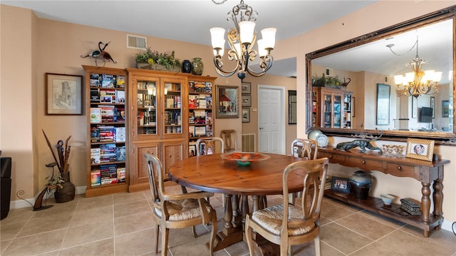 dining room featuring light tile patterned floors and a chandelier