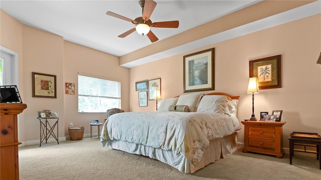 bedroom featuring light carpet and ceiling fan