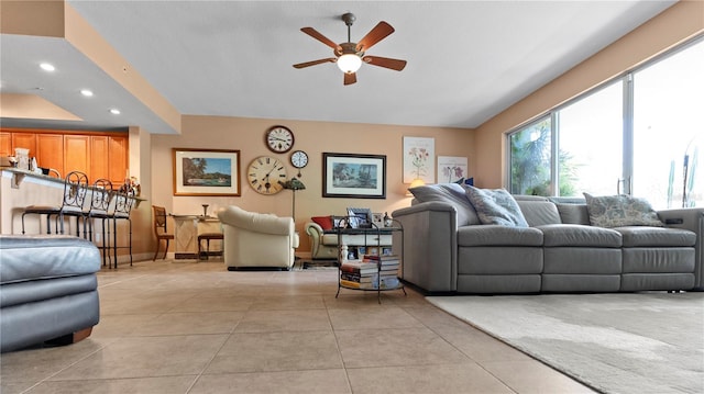 tiled living room with ceiling fan