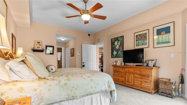 bedroom with ceiling fan and light carpet