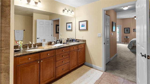 bathroom featuring ceiling fan, vanity, and tile patterned flooring