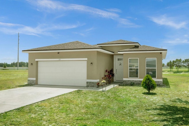 prairie-style house with a garage and a front yard