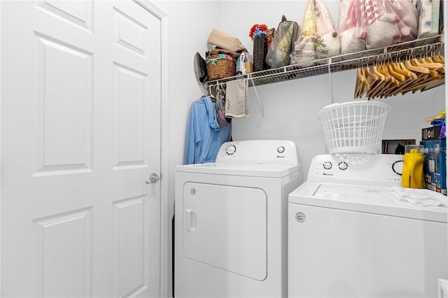 clothes washing area featuring washing machine and clothes dryer