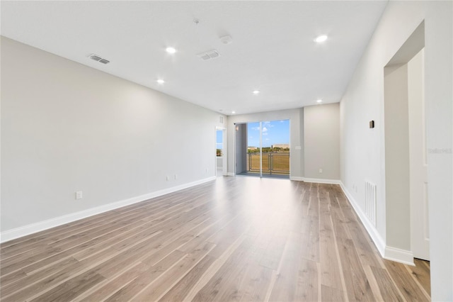 unfurnished living room featuring light hardwood / wood-style floors