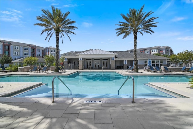 view of swimming pool with a patio