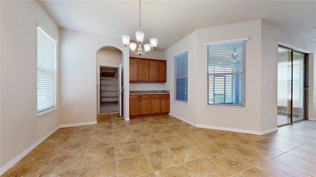 kitchen with an inviting chandelier and pendant lighting