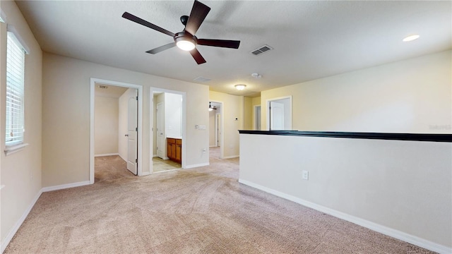 carpeted empty room with ceiling fan