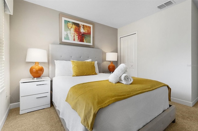 carpeted bedroom with a closet