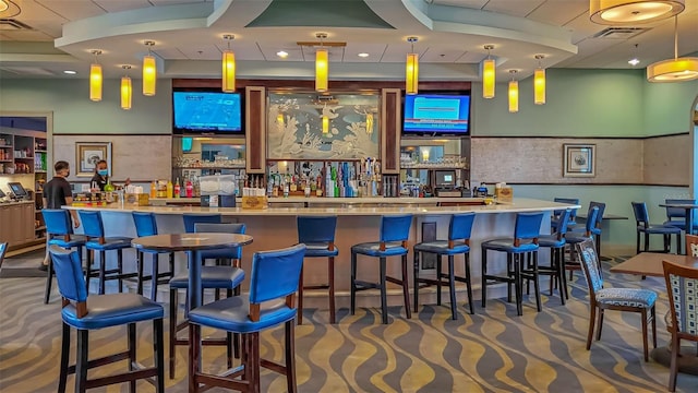 bar featuring decorative light fixtures