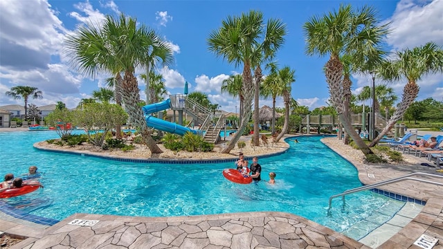 view of pool with a water slide