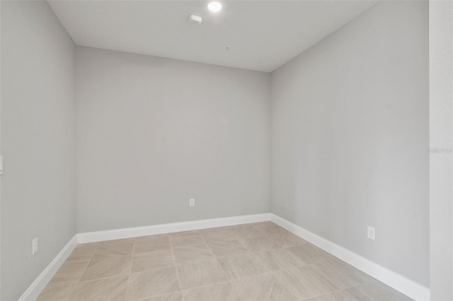 empty room with light tile patterned flooring