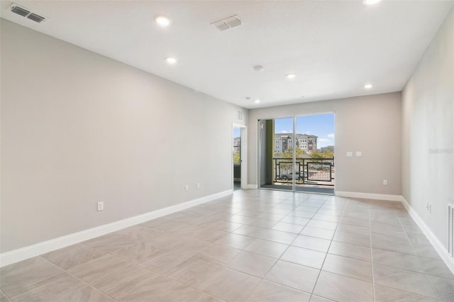 7557 Laureate Blvd Unit 6208, Orlando, FL 32827 - spare room featuring light tile patterned floors, recessed lighting, and baseboards