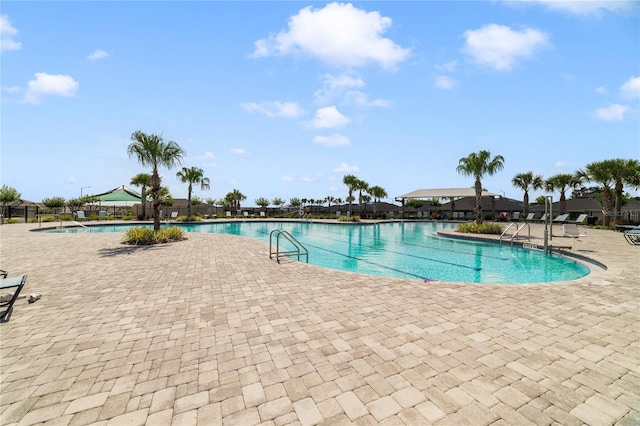 view of swimming pool featuring a patio