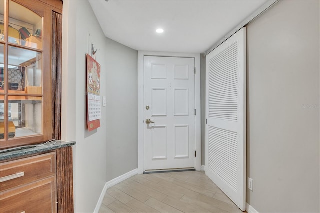 doorway with light hardwood / wood-style floors