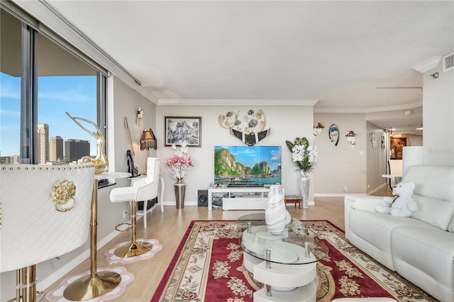 living room with hardwood / wood-style floors and ornamental molding