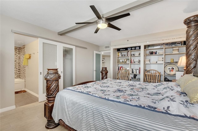 bedroom with ceiling fan, tile floors, and connected bathroom