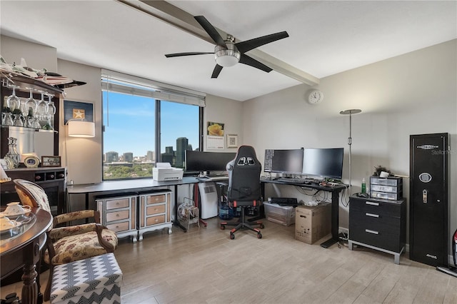 office space featuring ceiling fan and light wood-type flooring